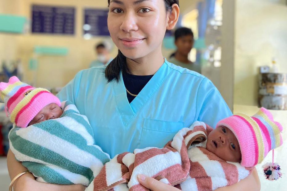 Nurse with premature twins